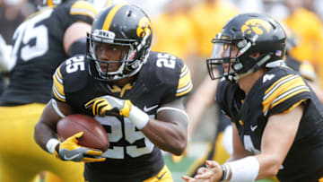 IOWA CITY, IOWA- SEPTEMBER 2: Running back Akrum Wadley #25 of the Iowa Hawkeyes takes a hand-off during the second quarter against the Wyoming Cowboys on September 2, 2017 at Kinnick Stadium in Iowa City, Iowa. (Photo by Matthew Holst/Getty Images)