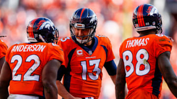 DENVER, CO - SEPTEMBER 17: Running back C.J. Anderson #22 of the Denver Broncos celebrates with quarterback Trevor Siemian #13 after a catch and run touchdown play in the second quarter of a game at Sports Authority Field at Mile High on September 17, 2017 in Denver, Colorado. (Photo by Justin Edmonds/Getty Images)