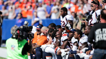 ORCHARD PARK, NY - SEPTEMBER 24: Denver Broncos players kneel during the American National Anthem before an NFL game against the Buffalo Bills on September 24, 2017 at New Era Field in Orchard Park, New York. (Photo by Brett Carlsen/Getty Images)