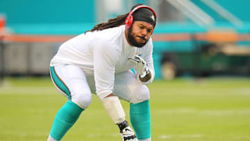 MIAMI GARDENS, FL - NOVEMBER 22: Billy Turner #77 of the Miami Dolphins warms up before the game against the Dallas Cowboys at Sun Life Stadium on November 22, 2015 in Miami Gardens, Florida. (Photo by Rob Foldy/Getty Images)