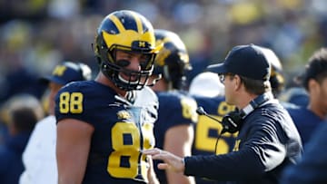 ANN ARBOR, MI - OCTOBER 22: Jake Butt #88 of the Michigan Wolverines talks with head coach Jim Harbaugh while playing the Illinois Fighting Illini on October 22, 2016 at Michigan Stadium in Ann Arbor, Michigan. (Photo by Gregory Shamus/Getty Images)