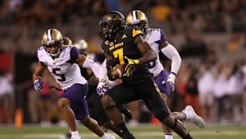 TEMPE, AZ - OCTOBER 14: Running back Kalen Ballage #7 of the Arizona State Sun Devils rushes the football against defensive back Myles Bryant #5 of the Washington Huskies during the first half of the college football game at Sun Devil Stadium on October 14, 2017 in Tempe, Arizona. The Sun Devils defeated the Huskies 13-7. (Photo by Christian Petersen/Getty Images)