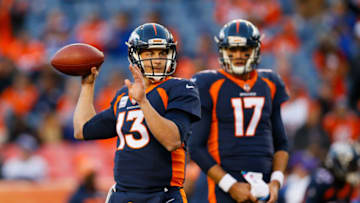 DENVER, CO - OCTOBER 15: Quarterback Trevor Siemian #13 of the Denver Broncos warms up as backup Quarterback Brock Osweiler #17 of the Denver Broncos looks on before a game against the New York Giants at Sports Authority Field at Mile High on October 15, 2017 in Denver, Colorado. (Photo by Justin Edmonds/Getty Images)