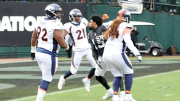 OAKLAND, CA - NOVEMBER 26: Michael Crabtree #15 of the Oakland Raiders fights with Aqib Talib #21 of the Denver Broncos in their NFL game at Oakland-Alameda County Coliseum on November 26, 2017 in Oakland, California. Both players were ejected from the game. (Photo by Robert Reiners/Getty Images)