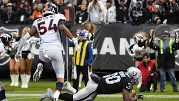 OAKLAND, CA - NOVEMBER 26: Jalen Richard #30 of the Oakland Raiders dives into the end zone for a six-yard touchdown against the Denver Broncos during their NFL game at Oakland-Alameda County Coliseum on November 26, 2017 in Oakland, California. (Photo by Robert Reiners/Getty Images)