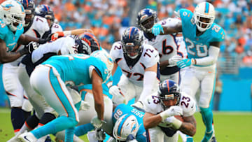 MIAMI GARDENS, FL - DECEMBER 03: Devontae Booker #23 of the Denver Broncos rushes during the second quarter against the Miami Dolphins at the Hard Rock Stadium on December 3, 2017 in Miami Gardens, Florida. (Photo by Chris Trotman/Getty Images)
