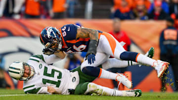 DENVER, CO - DECEMBER 10: Outside linebacker Shane Ray #56 of the Denver Broncos hits quarterback Josh McCown #15 of the New York Jets on a play where McCown would appear to injure his left hand and come out of the game in the third quarter of a game at Sports Authority Field at Mile High on December 10, 2017 in Denver, Colorado. (Photo by Dustin Bradford/Getty Images)