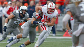 CHAMPAIGN, IL - OCTOBER 24: Troy Fumagalli #81 of the Wisconsin Badgers runs the ball after a catch as Tre Watson #33 of the Illinois Fighting Illini tries to make the tackle at Memorial Stadium on October 24, 2015 in Champaign, Illinois. (Photo by Michael Hickey/Getty Images)
