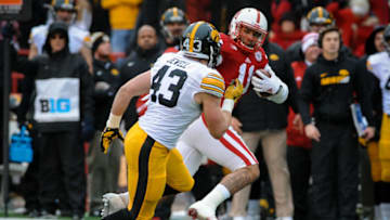 LINCOLN, NE - NOVEMBER 27: Tight end Cethan Carter #11 of the Nebraska Cornhuskers runs past linebacker Josey Jewell #43 of the Iowa Hawkeyesat Memorial Stadium November 27, 2015 in Lincoln, Nebraska. (Photo by Eric Francis/Getty Images)