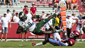 FAYETTEVILLE, AR - SEPTEMBER 14: Warren Jackson #9 of the Colorado State Rams dives to the one yard line after being tripped by Kamren Curl #2 of the Arkansas Razorbacks at Razorback Stadium on September 14, 2019 in Fayetteville, Arkansas. (Photo by Wesley Hitt/Getty Images)
