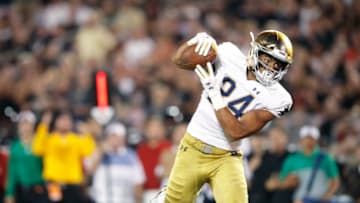 LOUISVILLE, KY - SEPTEMBER 02: Tommy Tremble #24 of the Notre Dame Fighting Irish makes a 26-yard touchdown reception during a game against the Louisville Cardinals at Cardinal Stadium on September 2, 2019 in Louisville, Kentucky. Notre Dame defeated Louisville 35-17. (Photo by Joe Robbins/Getty Images)