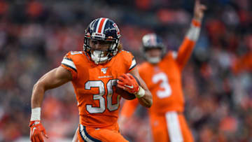 DENVER, CO - DECEMBER 22: Phillip Lindsay #30 of the Denver Bronco carries the ball against the Detroit Lions in the fourth quarter of a game at Empower Field on December 22, 2019 in Denver, Colorado. (Photo by Dustin Bradford/Getty Images)