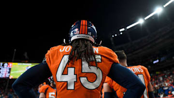 DENVER, CO - DECEMBER 29: Alexander Johnson #45 of the Denver Broncos stands int he bench area during a game against the Oakland Raiders at Empower Field at Mile High on December 29, 2019 in Denver, Colorado. (Photo by Dustin Bradford/Getty Images)