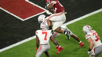 MIAMI GARDENS, FL - JANUARY 11: Najee Harris #22 of the Alabama Crimson Tide dives into the end zone for a touchdown against the Ohio State Buckeyes during the College Football Playoff National Championship held at Hard Rock Stadium on January 11, 2021 in Miami Gardens, Florida. (Photo by Jamie Schwaberow/Getty Images)