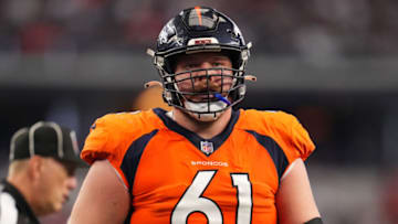 ARLINGTON, TEXAS - NOVEMBER 07: Graham Glasgow #61 of the Denver Broncos gets set against the Dallas Cowboys during an NFL game at AT&T Stadium on November 07, 2021 in Arlington, Texas. (Photo by Cooper Neill/Getty Images)