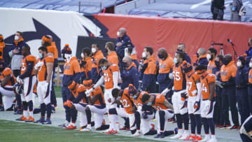 DENVER, COLORADO - NOVEMBER 29: The Denver Broncos during the national anthem prior to an NFL game against the New Orleans Saints, Sunday, Nov. 29, 2020, in Denver. (Photo by Cooper Neill/Getty Images)