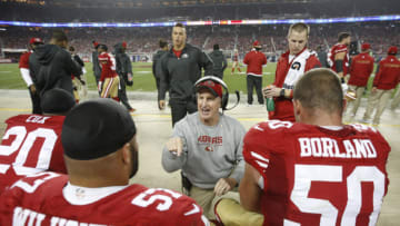 SANTA CLARA, CA - NOVEMBER 27: Linebackers Coach Jim Leavitt of the San Francisco 49ers talks with Michael Wilhoite #57 and Chris Borland #50 during the game against the Seattle Seahawks at Levi Stadium on November 27, 2014 in Santa Clara, California. The Seahawks defeated the 49ers 19-3. (Photo by Michael Zagaris/San Francisco 49ers/Getty Images)