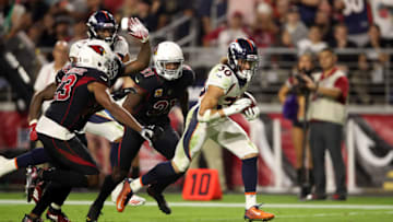 GLENDALE, AZ - OCTOBER 18: Running back Phillip Lindsay #30 of the Denver Broncos runs past cornerback Patrick Peterson #21 and linebacker Haason Reddick #43 of the Arizona Cardinals for a 28-yard touchdown during the fourth quarter at State Farm Stadium on October 18, 2018 in Glendale, Arizona. (Photo by Christian Petersen/Getty Images)