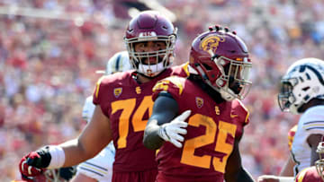 LOS ANGELES, CA - SEPTEMBER 02: Ronald Jones II #25 of the USC Trojans celebrates his touchdown with Nico Falah #74 to tie the game 14-14 with the Western Michigan Broncos at Los Angeles Memorial Coliseum on September 2, 2017 in Los Angeles, California. (Photo by Harry How/Getty Images)