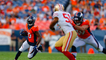 DENVER, CO - AUGUST 19: Wide receiver Emmanuel Sanders #10 of the Denver Broncos runs with the football as fullback George Aston #39 of the Denver Broncos blocks outside linebacker Malcolm Smith #51 of the San Francisco 49ers during the first quarter of a preseason game at Broncos Stadium at Mile High on August 19, 2019 in Denver, Colorado. (Photo by Justin Edmonds/Getty Images)