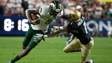 Colorado State junior receiver Warren Jackson (9) attempts to stiff arm Colorado cornerback Delrick Abrams Jr.(1) during the Rocky Mountain Showdown rivalry football game on Friday, August 30, 2019, at Broncos Stadium at Mile High in Denver, Colo.Rockymountainshowdown 20190830 Th