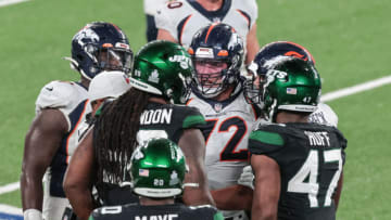 Oct 1, 2020; East Rutherford, New Jersey, USA; Denver Broncos offensive tackle Garett Bolles (72) argues with New York Jets nose tackle Steve McLendon (99) during the second half at MetLife Stadium. Mandatory Credit: Vincent Carchietta-USA TODAY Sports