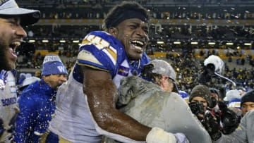 Denver Broncos; Winnipeg Blue Bombers defensive end Jonathan Kongbo (2) hugs head coach Mike O'Shea after he get doused with gatorade in the 108th Grey Cup football game against the Hamilton Tiger-Cats at Tim Hortons Field. Mandatory Credit: John E. Sokolowski-USA TODAY Sports