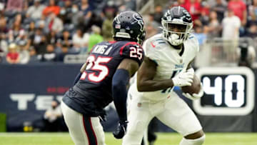 Denver Broncos offseason - Tennessee Titans wide receiver A.J. Brown (11) gains a first down past Houston Texans cornerback Desmond King II (25) during the second quarter at NRG Stadium Sunday, Jan. 9, 2022 in Houston, Texas.Titans Texans 062