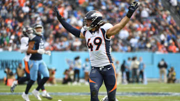 Nov 13, 2022; Nashville, Tennessee, USA; Denver Broncos linebacker Alex Singleton (49) celebrates after a defensive stop against Tennessee Titans tight end Austin Hooper (81) during the first half at Nissan Stadium. Mandatory Credit: Christopher Hanewinckel-USA TODAY Sports