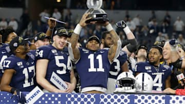 Dec 28, 2019; Arlington, Texas, USA; Penn State Nittany Lions linebacker Micah Parsons (11) holds up the most outstanding defensive player award after the game against the Memphis Tigers at AT&T Stadium. Mandatory Credit: Tim Heitman-USA TODAY Sports