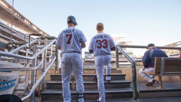 Joe Mauer and Justin Morneau of the Minnesota Twins look on. (Photo by Brace Hemmelgarn/Minnesota Twins/Getty Images)