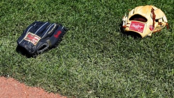 BOSTON, MA - June 4: Two Rawlings baseball gloves are seen on the field before the game between the Boston Red Sox and the Minnesota Twins at Fenway Park on June 4, 2015 in Boston, Massachusetts. (Photo by Winslow Townson/Getty Images)