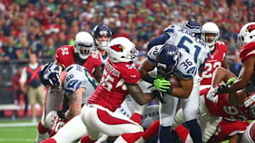 Jan 3, 2016; Glendale, AZ, USA; Seattle Seahawks running back Bryce Brown (36) pushes past Arizona Cardinals linebacker Sean Weatherspoon (55) for a first quarter touchdown at University of Phoenix Stadium. Mandatory Credit: Mark J. Rebilas-USA TODAY Sports