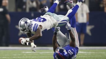 Sep 13, 2015; Arlington, TX, USA; Dallas Cowboys wide receiver Dez Bryant (88) catches the ball as New York Giants cornerback Prince Amukamara (20) tackles at AT&T Stadium. The Cowboys won 27-26. Mandatory Credit: Tim Heitman-USA TODAY Sports