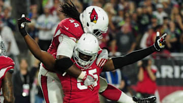 Oct 23, 2016; Glendale, AZ, USA; Arizona Cardinals outside linebacker Chandler Jones (55) celebrates with outside linebacker Markus Golden (44) after stripping the ball from Seattle Seahawks quarterback Russell Wilson (3) during the second half at University of Phoenix Stadium. Mandatory Credit: Matt Kartozian-USA TODAY Sports