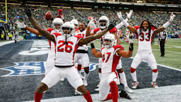 SEATTLE, WA - DECEMBER 30: Brandon Williams #26 and Zeke Turner #47 and other members of the Arizona Cardinals celebrate after tying the score in the third quarter against the Seattle Seahawks at CenturyLink Field on December 30, 2018 in Seattle, Washington. (Photo by Otto Greule Jr/Getty Images)