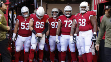 GLENDALE, ARIZONA - NOVEMBER 06: Center Billy Price #53, tight end Zach Ertz #86, linebacker Cameron Thomas #97, guard Cody Ford #72 and offensive tackle Kelvin Beachum #68 of the Arizona Cardinals wait to take the field before the game against the Seattle Seahawks at State Farm Stadium on November 06, 2022 in Glendale, Arizona. The Seahawks beat the Cardinals 31-21. (Photo by Chris Coduto/Getty Images)
