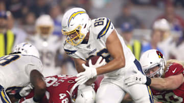 GLENDALE, ARIZONA - AUGUST 08: Hunter Henry #86 of the Los Angeles Chargers is tackled by the Arizona Cardinals during a preseason game at State Farm Stadium on August 08, 2019 in Glendale, Arizona. (Photo by Christian Petersen/Getty Images)
