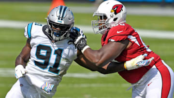 CHARLOTTE, NORTH CAROLINA - OCTOBER 04: Kelvin Beachum #68 of the Arizona Cardinals blocks Stephen Weatherly #91 of the Carolina Panthers during the first quarter of their game at Bank of America Stadium on October 04, 2020 in Charlotte, North Carolina. (Photo by Grant Halverson/Getty Images)