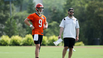 CINCINNATI, OHIO - JULY 29: Joe Burrow #9 of the Cincinnati Bengals and offensive coordinator Brian Callahan look on during training camp on July 29, 2021 in Cincinnati, Ohio. (Photo by Dylan Buell/Getty Images)