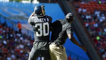 Jan 31, 2016; Honolulu, HI, USA; Team Irvin running back Todd Gurley of the Los Angeles Rams (30) celebrates with Michael Irvin after a touchdown during the 2016 Pro Bowl at Aloha Stadium. Mandatory Credit: Kirby Lee-USA TODAY Sports