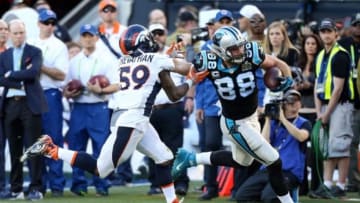 Feb 7, 2016; Santa Clara, CA, USA; Carolina Panthers tight end Greg Olsen (88) runs the ball against Denver Broncos inside linebacker Danny Trevathan (59) during the second quarter in Super Bowl 50 at Levi