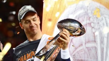 Feb 7, 2016; Santa Clara, CA, USA; Denver Broncos quarterback Peyton Manning (18) hoists the Vince Lombardi Trophy as he celebrates after defeating the Carolina Panthers in Super Bowl 50 at Levi