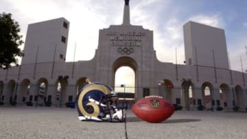 Mar 4, 2016; Los Angeles, CA, USA; General view of Los Angeles Rams helmet and NFL Wilson Duke football and the Olympic torch at the peristyle end of the Los Angeles Memorial Coliseum. The Coliseum will serve as the temporary home of the Rams after NFL owners voted 30-2 to allow Rams owner Stan Kroenke (not pictured) to relocate the franchise for the 2016 season. Mandatory Credit: Kirby Lee-USA TODAY Sports