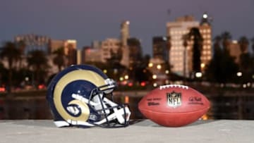 Feb 16, 2016; Los Angeles, CA, USA; General view of Los Angeles Rams helmet and NFL Wilson Duke football at McArthur Park with the downtown Los Angeles skyline as a backdrop. NFL owners voted 30-2 to allow owner Stan Kroenke (not pictured) to move the St. Louis Rams to Los Angeles for the 2016 season. Mandatory Credit: Kirby Lee-USA TODAY Sports