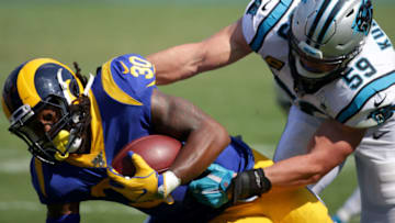 CHARLOTTE, NORTH CAROLINA - SEPTEMBER 08: Todd Gurley #30 of the Los Angeles Rams is tackled by Luke Kuechly #59 of the Carolina Panthers during their game at Bank of America Stadium on September 08, 2019 in Charlotte, North Carolina. (Photo by Streeter Lecka/Getty Images)