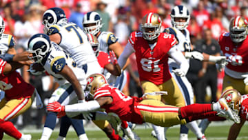LOS ANGELES, CA - OCTOBER 13: Running back Malcolm Brown #34 of the Los Angeles Rams gets away from middle linebacker Kwon Alexander #56 of the San Francisco 49ers as he gains a first down in the first half of the game at the Los Angeles Memorial Coliseum on October 13, 2019 in Los Angeles, California. (Photo by Jayne Kamin-Oncea/Getty Images)