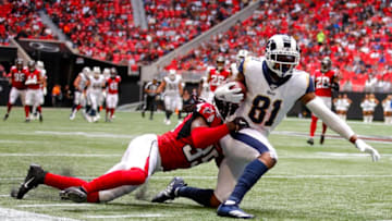 ATLANTA, GA - OCTOBER 20: Gerald Everett #81 of the Los Angeles Rams is tackled by Jamal Carter #35 of the Atlanta Falcons in the second half of an NFL game at Mercedes-Benz Stadium on October 20, 2019 in Atlanta, Georgia. (Photo by Todd Kirkland/Getty Images)