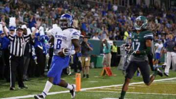 NEW ORLEANS, LA - OCTOBER 14: Running back Darrell Henderson #8 of the Memphis Tigers scores a touchdown past cornerback Parry Nickerson #17 of the Tulane Green Wave during the first half of a game at Yulman Stadium on October 14, 2016 in New Orleans, Louisiana. (Photo by Jonathan Bachman/Getty Images)
