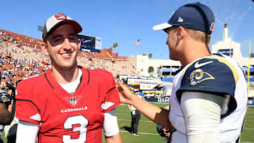 LOS ANGELES, CA - SEPTEMBER 16: Josh Rosen #3 of the Arizona Cardinals and Jared Goff #16 of the Los Angeles Rams enjoy a laugh after a handshake at the end of the game during a 34-0 Rams win at Los Angeles Memorial Coliseum on September 16, 2018 in Los Angeles, California. (Photo by Harry How/Getty Images)